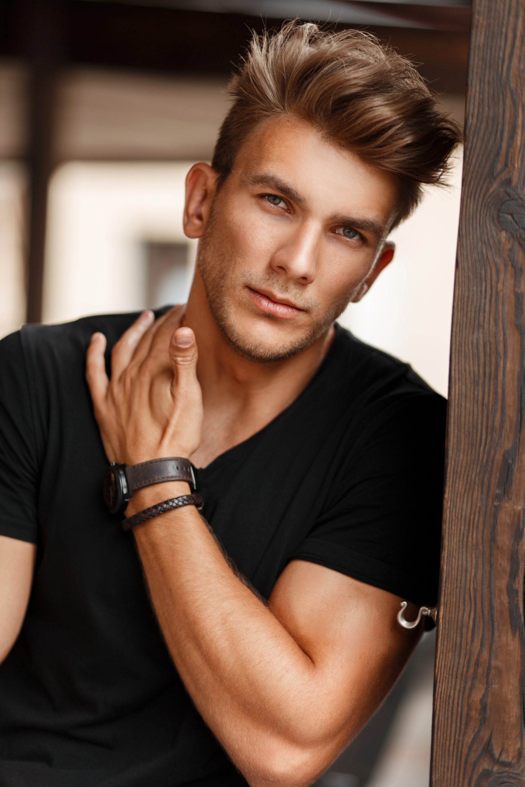 Fresh portrait of a beautiful young model man in a black T-shirt